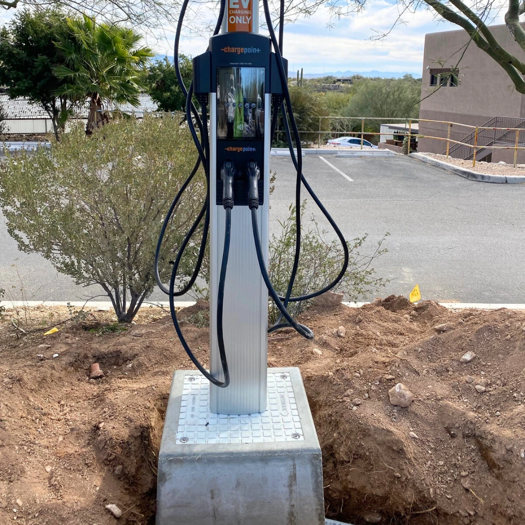 EV charger being installed on the Standard EV Block foundation base.